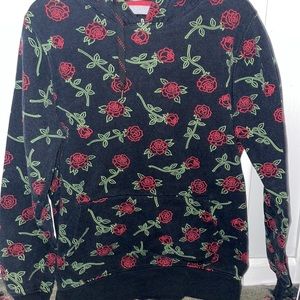 Black sweatshirt with roses. Size medium.